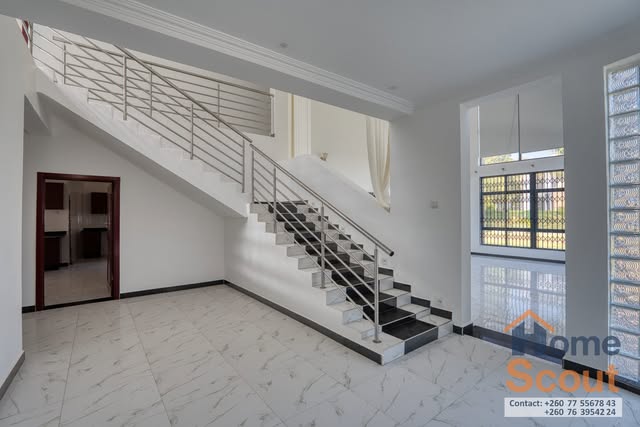 Staircase in the double-height entrance hall